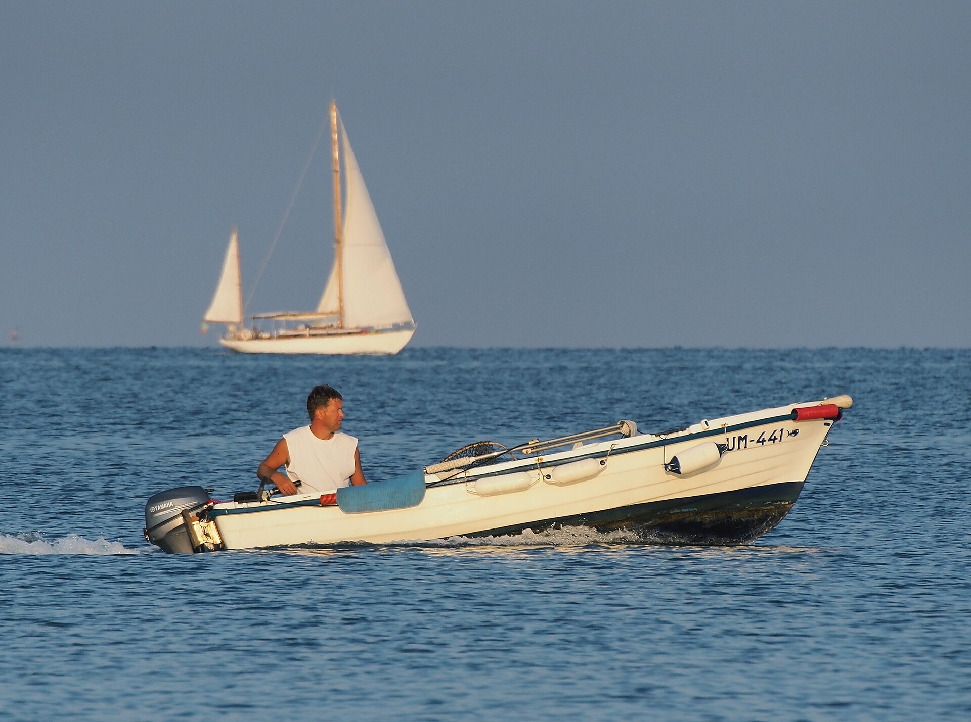 Couple toasting with sparkling wine on a private speedboat charter